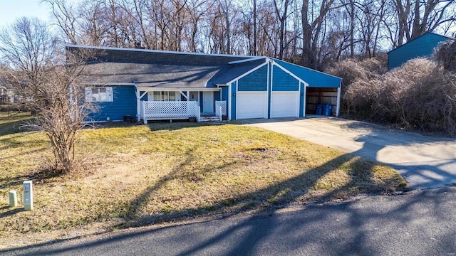 exterior space with a garage, concrete driveway, covered porch, a carport, and a front yard