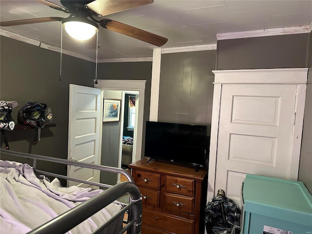 bedroom featuring a ceiling fan and crown molding