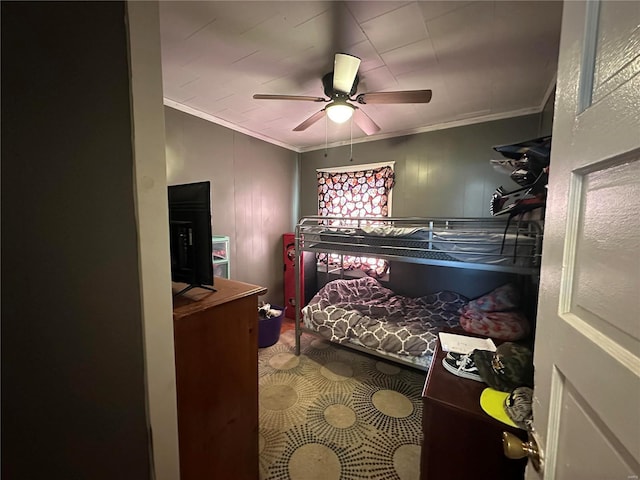 bedroom with ceiling fan and crown molding