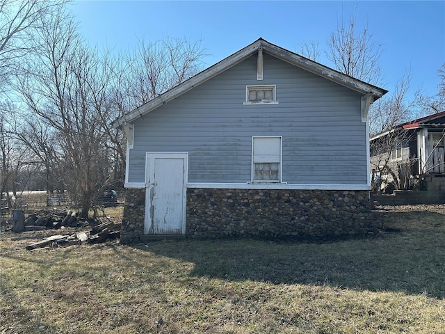 view of home's exterior featuring a yard