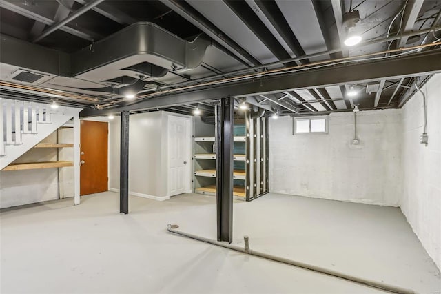 basement featuring stairway and visible vents
