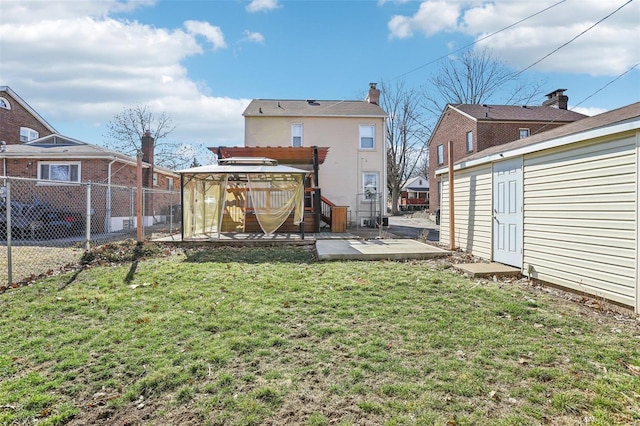 back of property featuring fence, a pergola, a lawn, and a patio