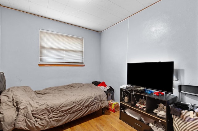 bedroom featuring wood finished floors