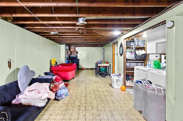 unfinished basement featuring washer and dryer and tile patterned floors