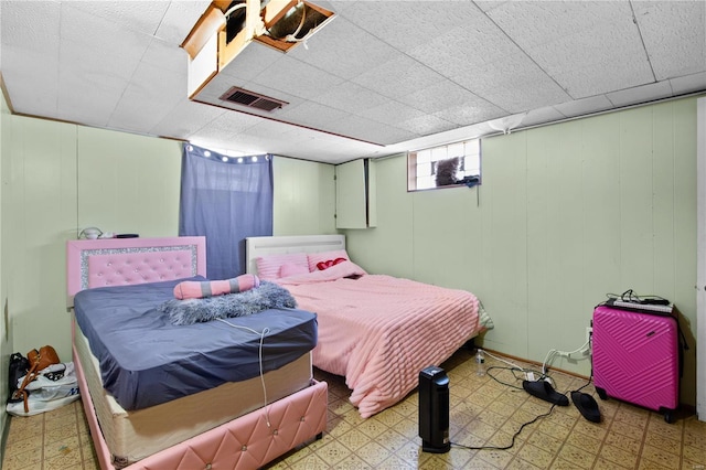 bedroom with visible vents and light floors