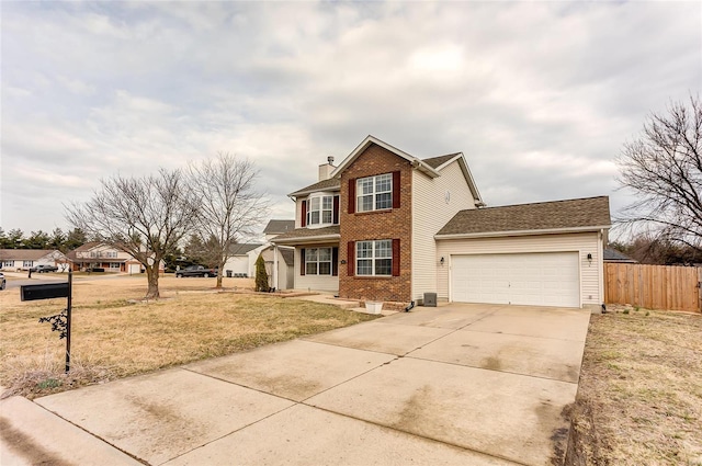 traditional-style home featuring a chimney, fence, a garage, driveway, and a front lawn