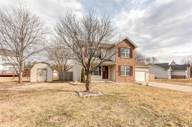 traditional-style house with brick siding, fence, driveway, a storage unit, and a front yard