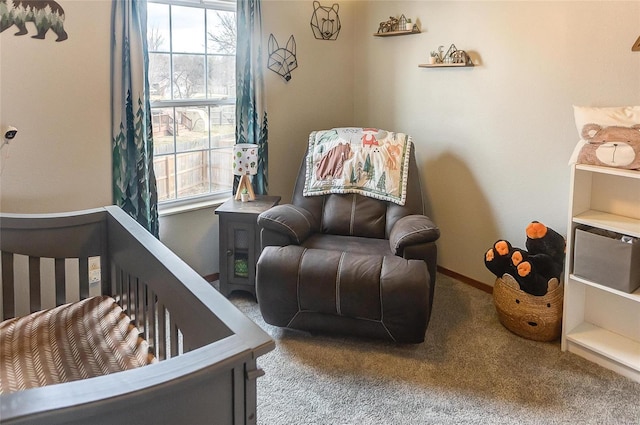 bedroom featuring carpet and baseboards