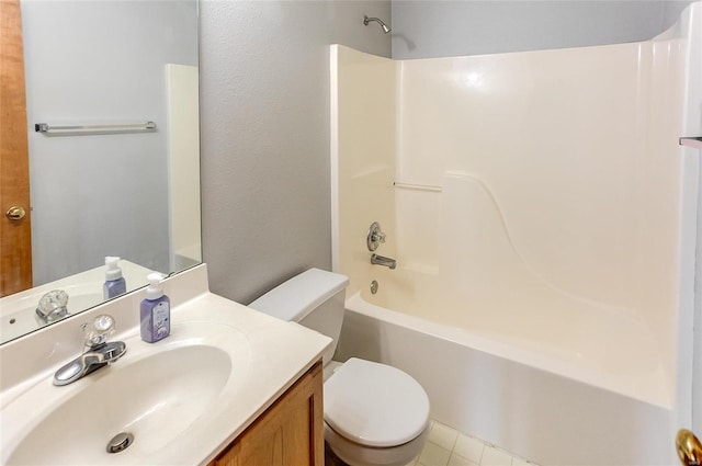 bathroom with shower / bathing tub combination, vanity, and toilet