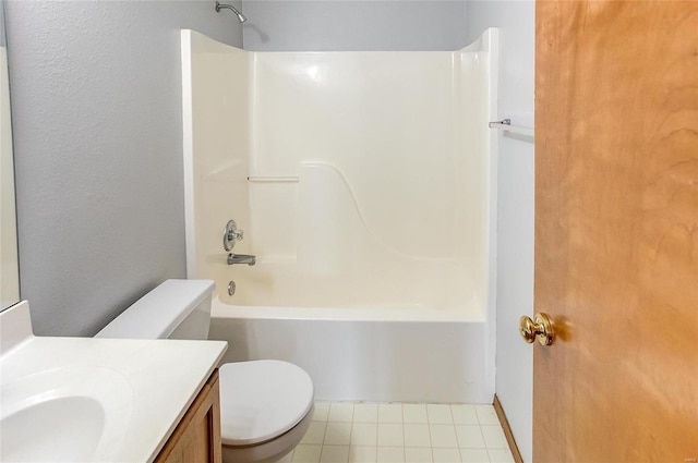 bathroom with toilet, tile patterned floors, shower / bathing tub combination, and vanity