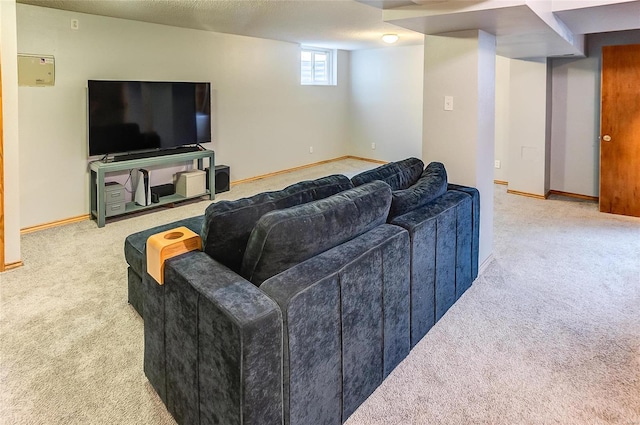 living room featuring a textured ceiling, carpet flooring, and baseboards