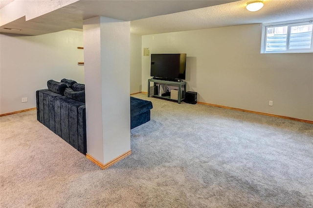 living room featuring a textured ceiling, carpet, and baseboards