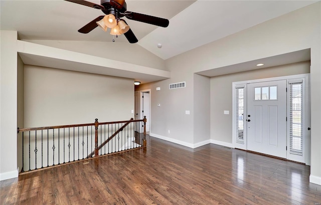 entryway featuring visible vents, vaulted ceiling, baseboards, and wood finished floors