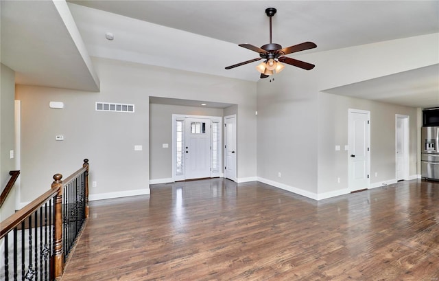 entryway featuring baseboards, visible vents, a ceiling fan, lofted ceiling, and dark wood-style floors