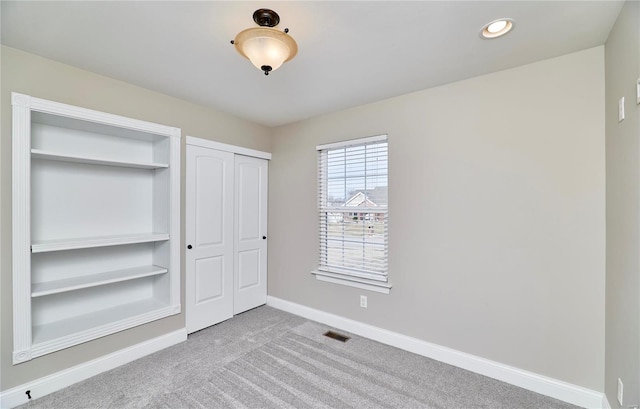 unfurnished bedroom with recessed lighting, carpet flooring, and baseboards