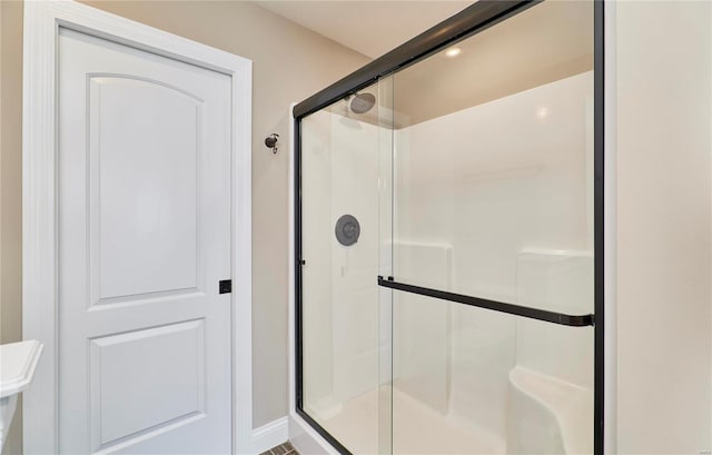 bathroom with a shower stall