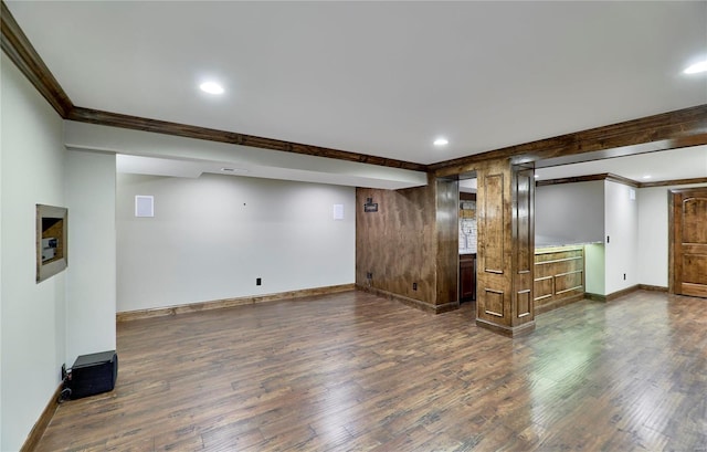 interior space featuring ornamental molding, recessed lighting, dark wood finished floors, and baseboards