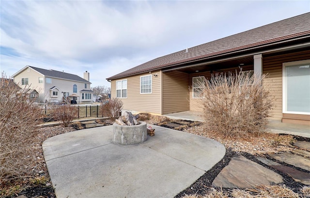 back of property with a patio and fence