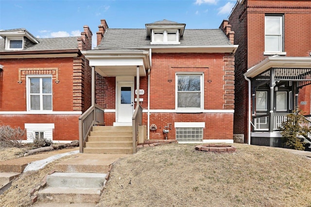 view of front of house featuring brick siding