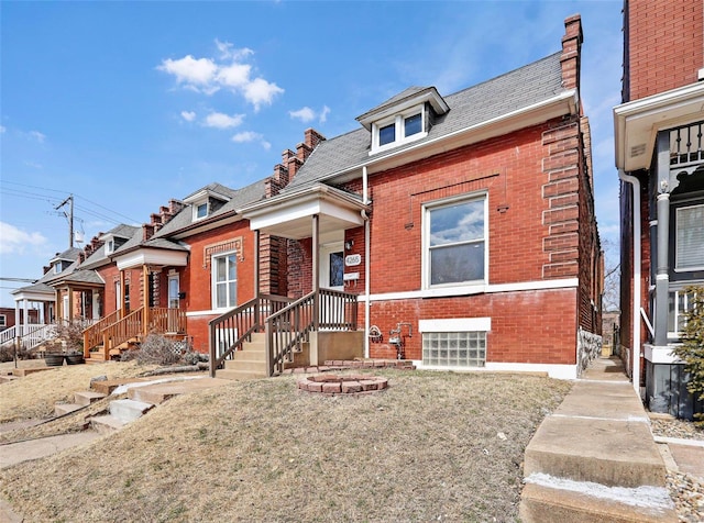 view of front of home featuring brick siding