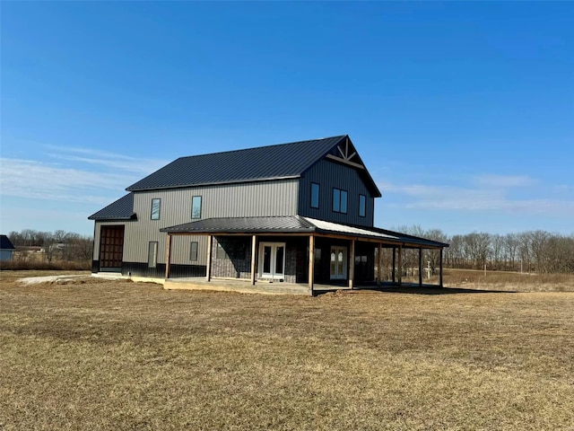 rear view of house with metal roof