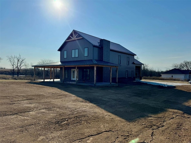 exterior space featuring metal roof