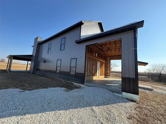 view of side of home featuring a garage