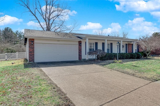 ranch-style house with a garage, brick siding, fence, driveway, and a front yard