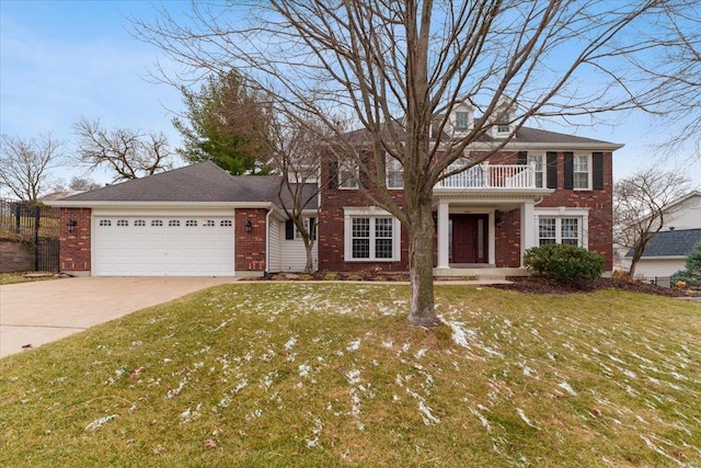 view of front of house featuring a balcony, driveway, an attached garage, and a front yard