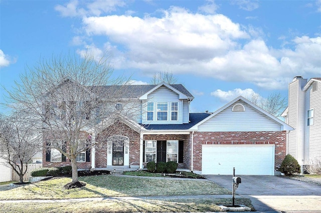 view of front of home featuring a garage, a front yard, brick siding, and driveway