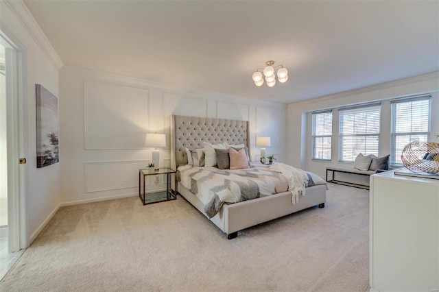 bedroom with light carpet, ornamental molding, and a decorative wall