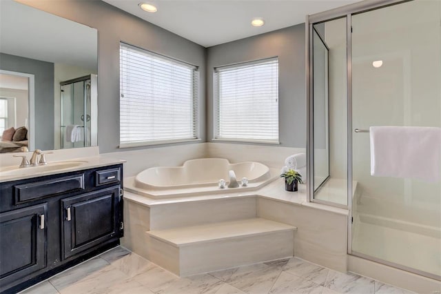 full bath with recessed lighting, vanity, marble finish floor, a shower stall, and a bath