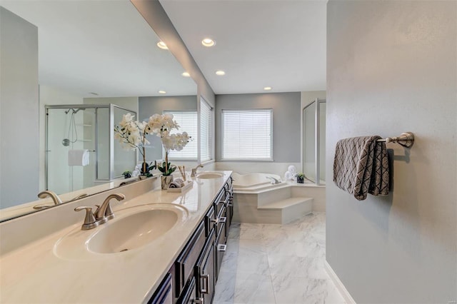 full bathroom featuring marble finish floor, a sink, a shower stall, and a bath