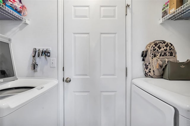 laundry area with laundry area and independent washer and dryer