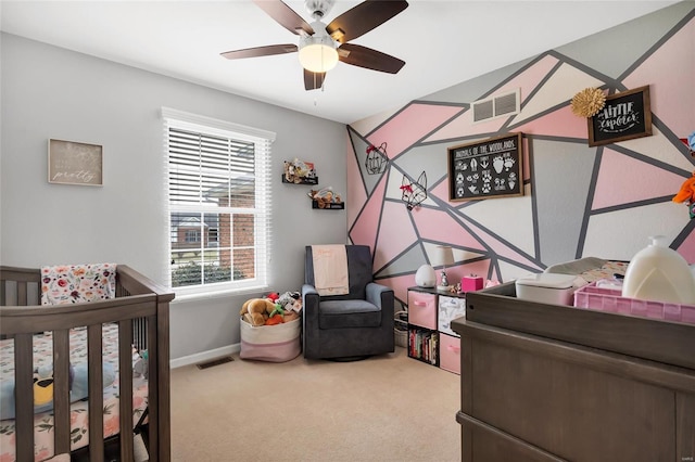 carpeted bedroom with visible vents and baseboards