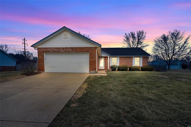 ranch-style house featuring a garage, brick siding, driveway, and a lawn