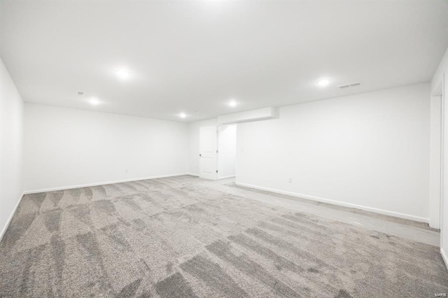 finished basement featuring recessed lighting, baseboards, visible vents, and carpet floors