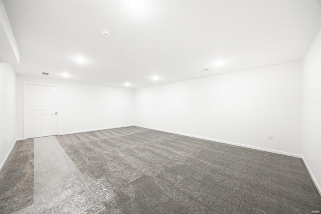 carpeted empty room with recessed lighting and baseboards