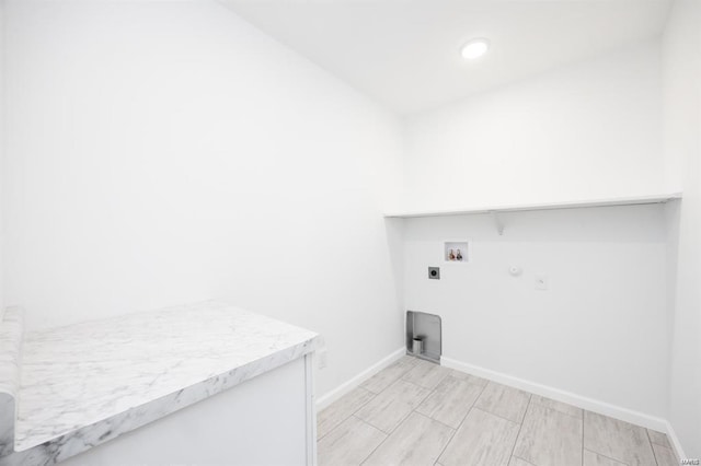 clothes washing area with baseboards, washer hookup, laundry area, hookup for a gas dryer, and electric dryer hookup