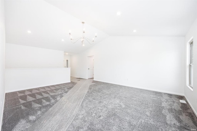 empty room with baseboards, carpet, lofted ceiling, recessed lighting, and an inviting chandelier