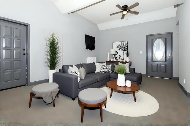 carpeted living room featuring lofted ceiling, baseboards, and a ceiling fan