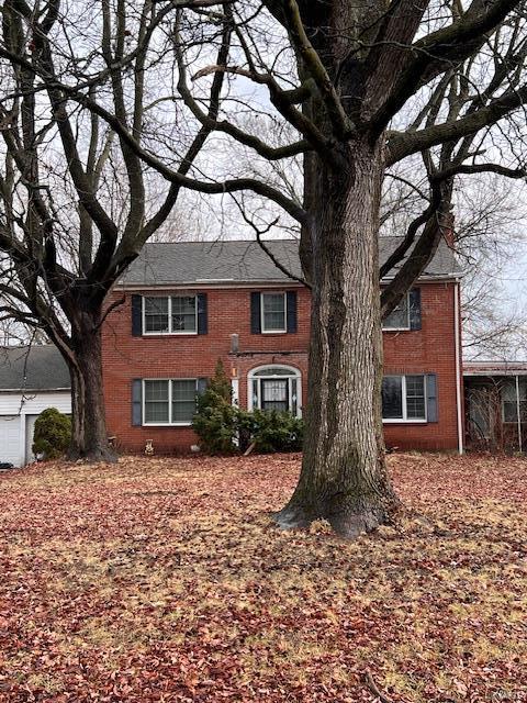 colonial house with brick siding