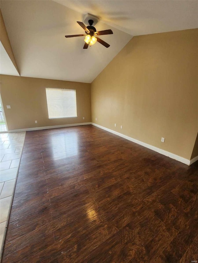 unfurnished room featuring lofted ceiling, a ceiling fan, baseboards, and wood finished floors