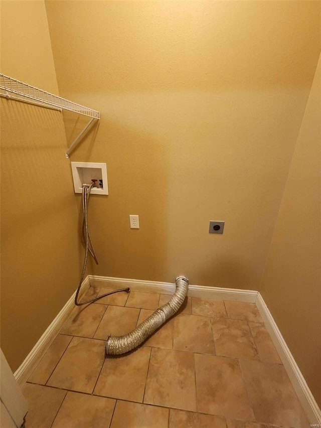 laundry area featuring baseboards, laundry area, hookup for a washing machine, and hookup for an electric dryer