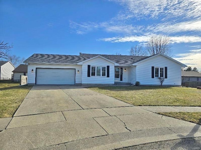 ranch-style house with a garage, driveway, fence, and a front lawn