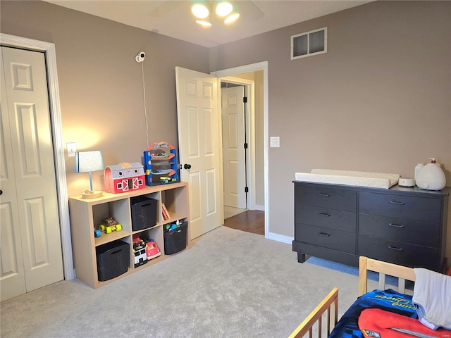 bedroom featuring ceiling fan, visible vents, and carpet flooring