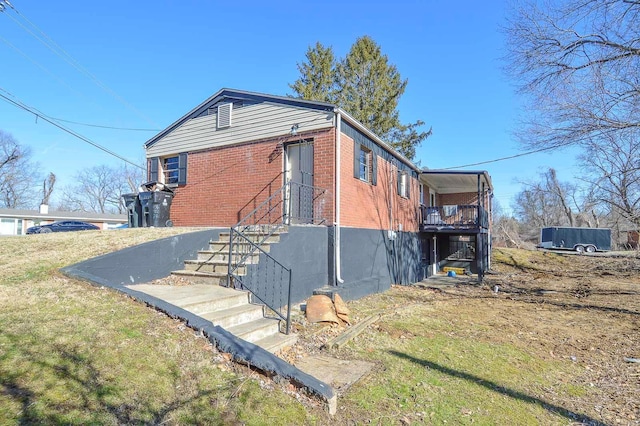 view of side of property with brick siding