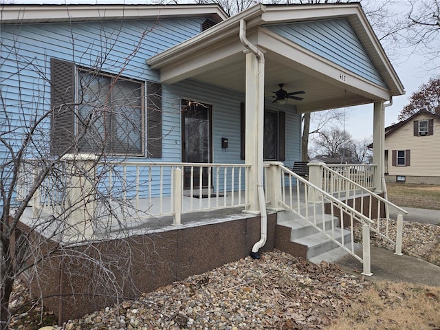 doorway to property featuring a porch and a ceiling fan