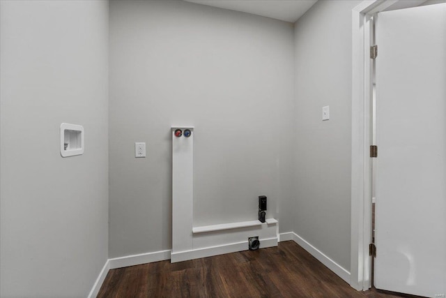 laundry area with laundry area, dark wood-style flooring, and baseboards