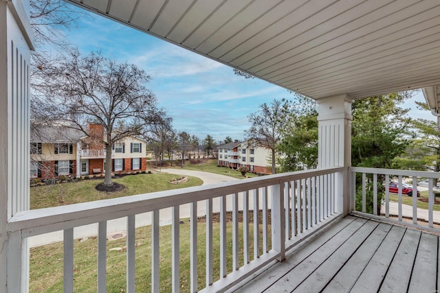 wooden terrace featuring a residential view